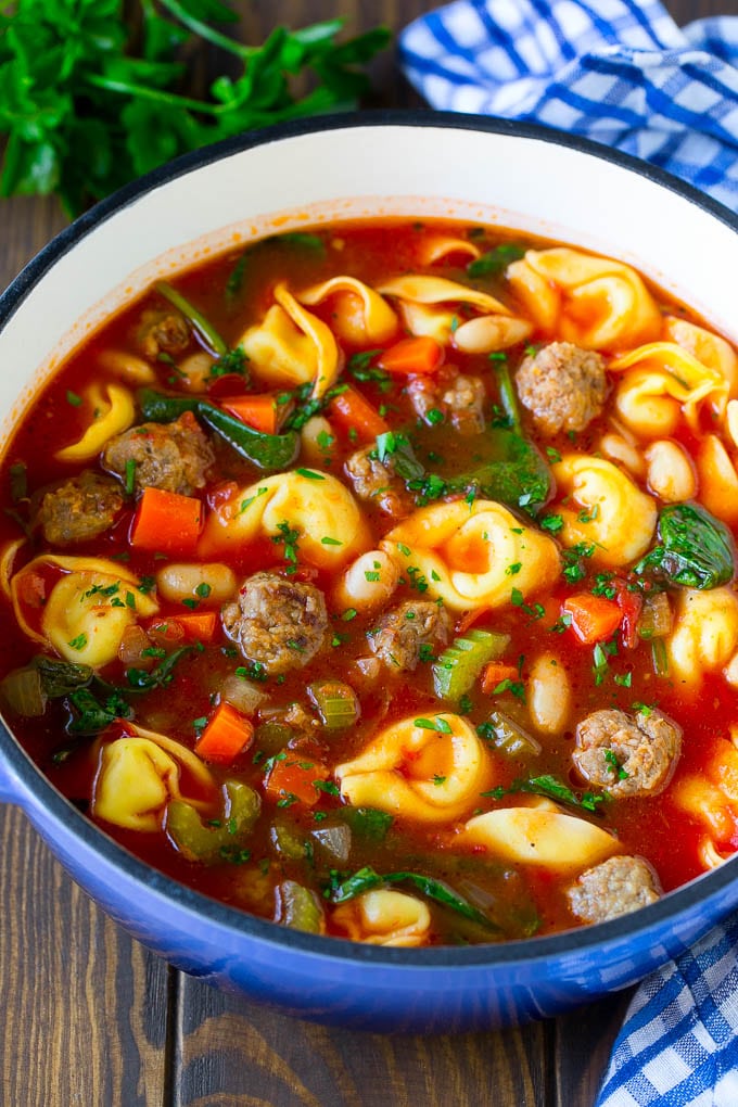Tortellini Soup Recipe | Sausage Soup | Italian Soup #soup #sausage #pasta #tortellini #dinner #edsug A pot of tortellini soup with tomato broth, Italian sausage, spinach and carrots.