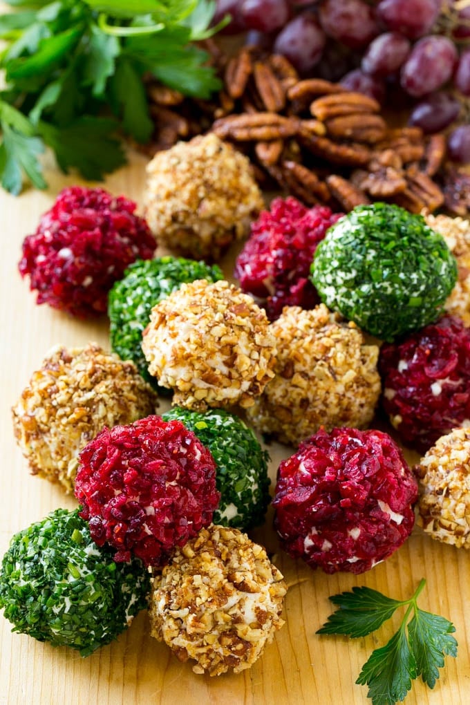Cheese Ball Bites Recipe | Holiday Cheese Ball Recipe | Pecan Cheese Ball | Cranberry Cheese Ball | Mini Cheese Balls #cheeseball #cheese #appetizer #edsug Cheese ball bites rolled in assorted toppings and served with fruit and nuts.