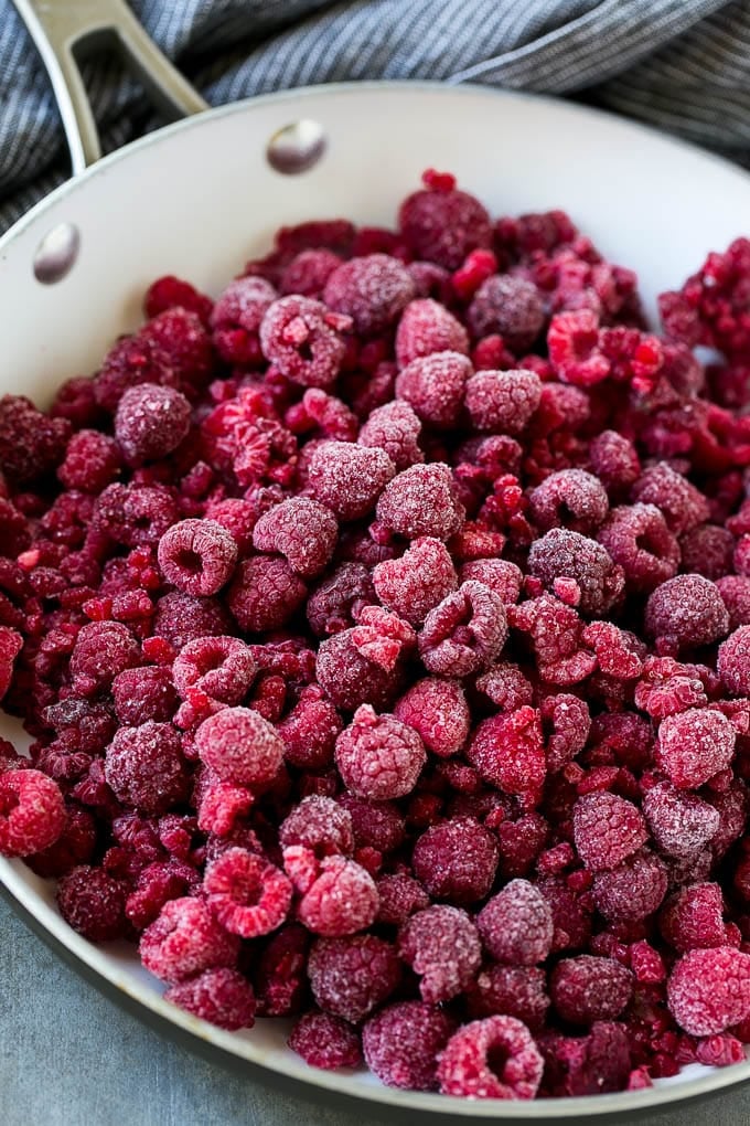 Raspberry Sauce Recipe | Homemade Raspberry Sauce | Raspberry Recipe #raspberries #dessert #edsug A pan of frozen berries.
