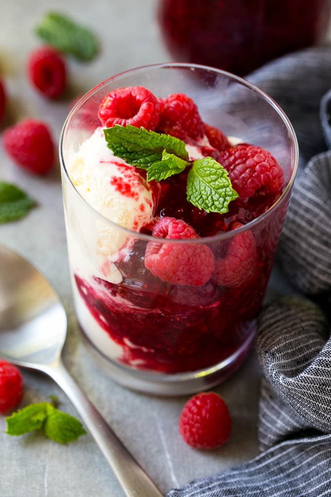 Raspberry Sauce Recipe | Homemade Raspberry Sauce | Raspberry Recipe #raspberries #dessert #edsug A cup of vanilla ice cream with raspberry sauce and fresh raspberries.