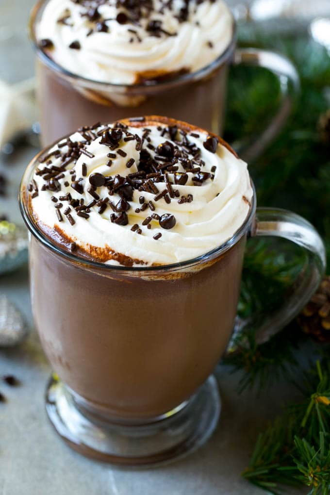 Slow Cooker Hot Chocolate Recipe | Homemade Hot Chocolate | Slow Cooker Hot Cocoa | Crock Pot Hot Chocolate #cocoa #hotchocolate #chocolate #slowcooker #crockpot #holiday #christmas #drink A mug of crock pot hot cocoa topped with whipped cream.