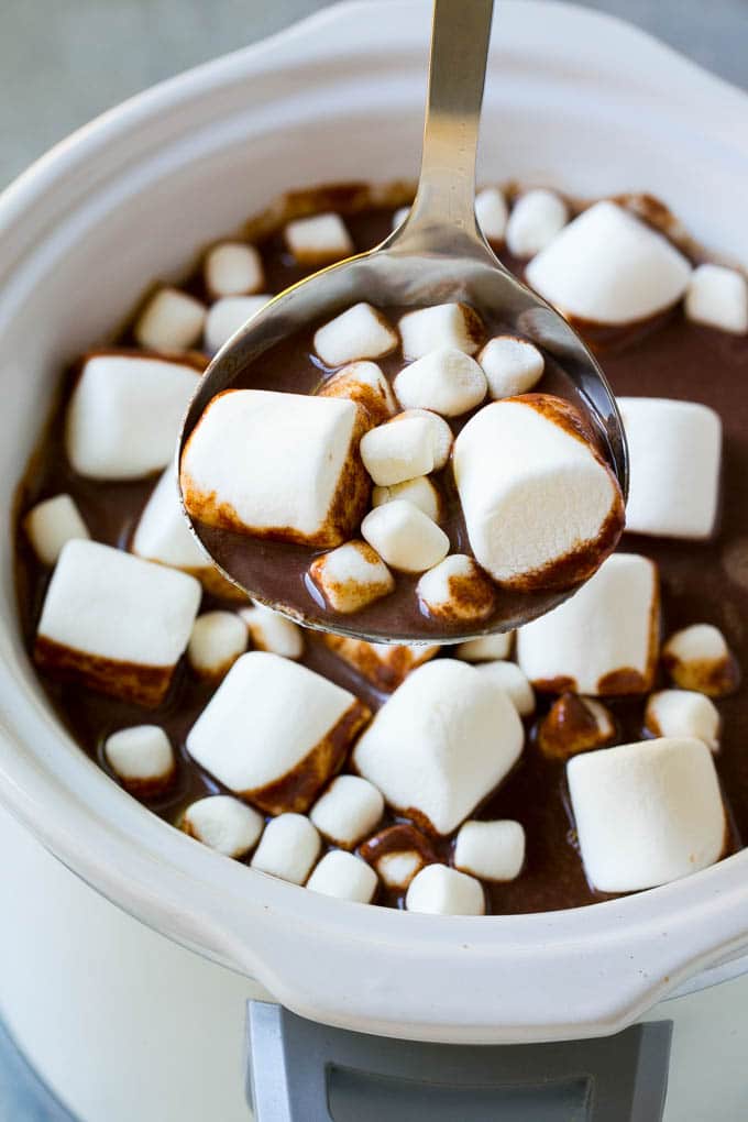 Slow Cooker Hot Chocolate Recipe | Homemade Hot Chocolate | Slow Cooker Hot Cocoa | Crock Pot Hot Chocolate #cocoa #hotchocolate #chocolate #slowcooker #crockpot #holiday #christmas #drink A ladle full of slow cooker hot chocolate topped with marshmallows.