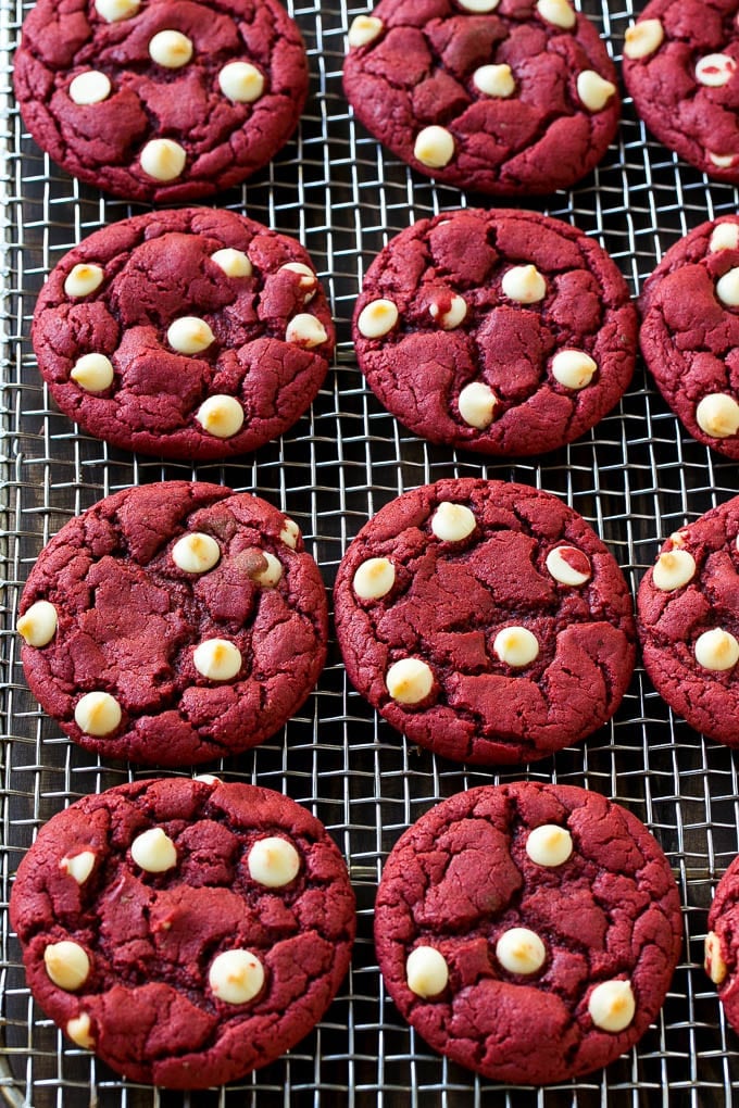 Red Velvet Cookies Recipe | Red Velvet Cookies with White Chocolate Chips | Red Velvet Cake Mix Cookies #redvelvet #cookies #whitechocolate #christmas #edsug Baked cookies on a wire cooling rack.