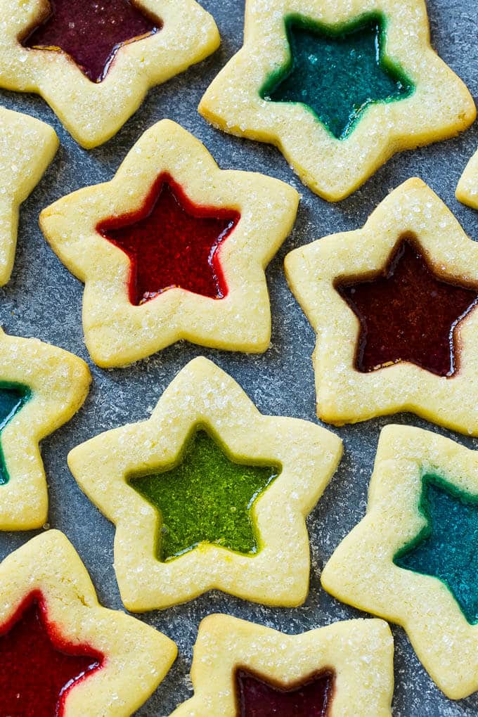 Stained Glass Cookies | Stained Glass Window Cookies | Christmas Cookies | Sugar Cookies | Holiday Cookies #cookies #stainedglasscookies #sugarcookies #christmascookies #christmas #holiday #dessert #edsug Stained glass window cookies in various colors.