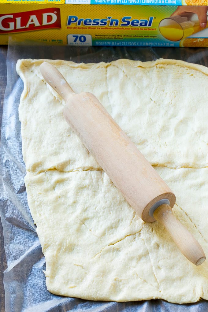 Veggie Pizza Recipe | Crescent Veggie Pizza | Vegetable Pizza Recipe | Holiday Appetizer | Homemade Veggie Pizza #pizza #veggies #vegetarian #appetizer #edsug Crescent roll dough rolled out into a rectangle.