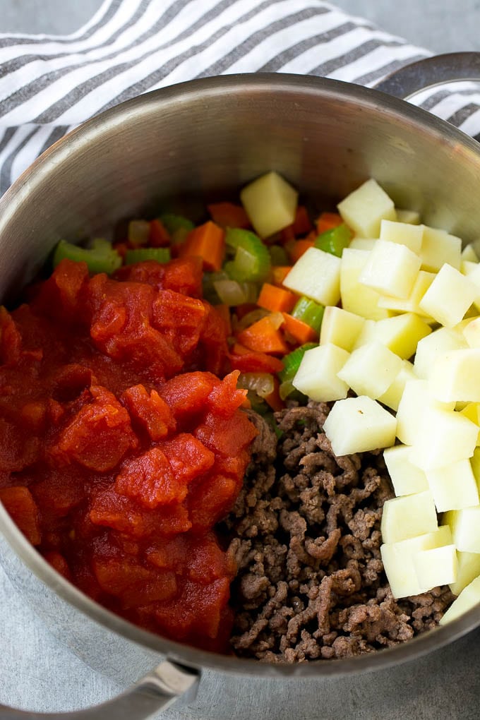 Hamburger Soup Recipe | Hamburger Stew | Ground Beef Soup #hamburger #soup #groundbeef #stew #dinner #edsug Potatoes and tomatoes go into hamburger soup before the pot comes to a simmer.