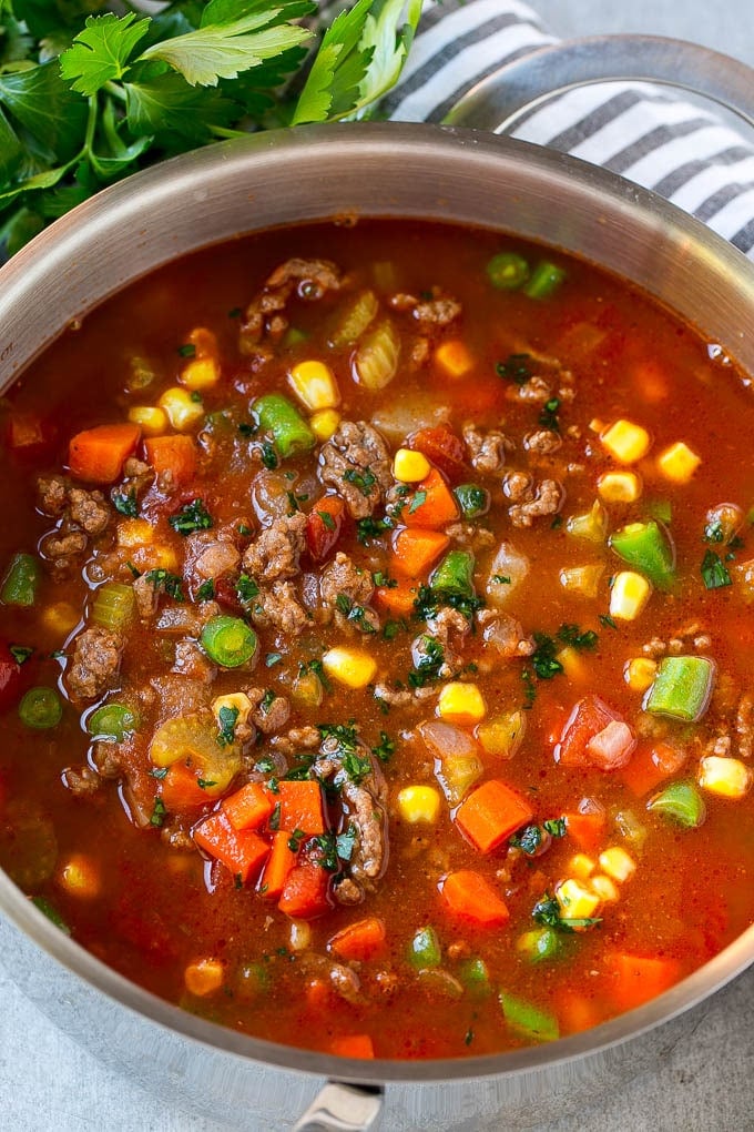 Hamburger Soup Recipe | Hamburger Stew | Ground Beef Soup #hamburger #soup #groundbeef #stew #dinner #edsug A pot of hamburger soup filled with cooked ground beef, veggies and seasonings.