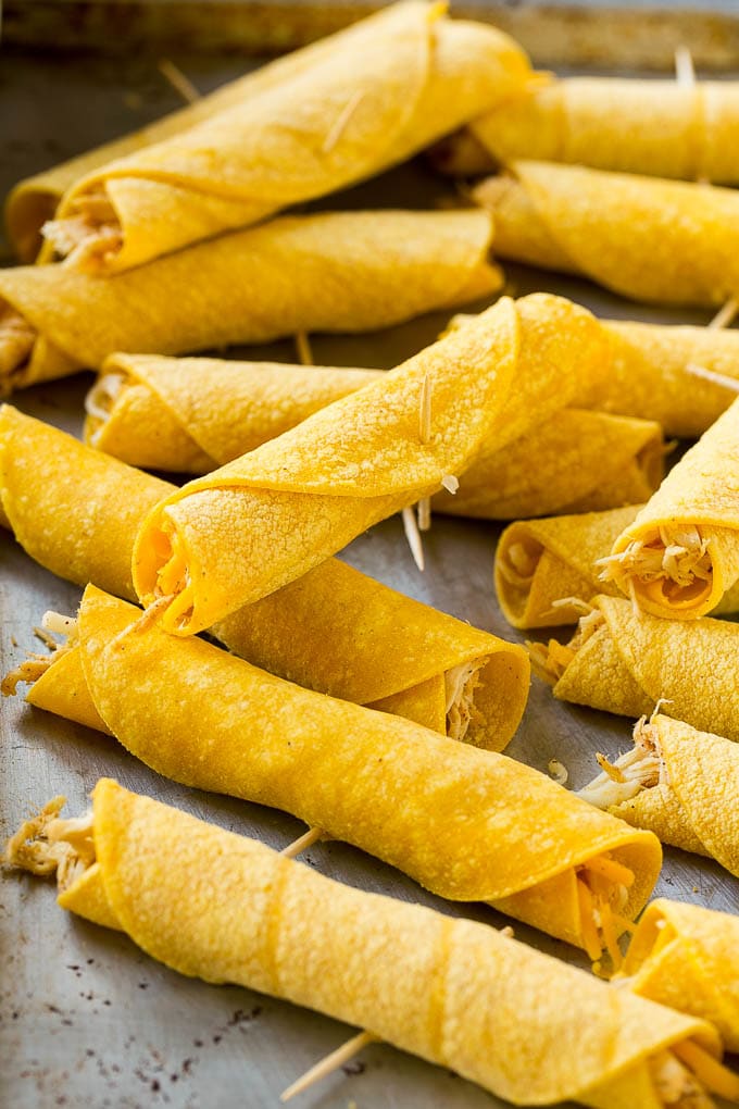 Chicken Taquitos Recipe | Baked Chicken Taquitos | Fried Chicken Taquitos | Mexican Appetizer | Chicken Tortillas #taquitos #chicken #appetizer #tortillas #mexicanfood #edsug Rolled up chicken taquitos ready for the fryer or oven.