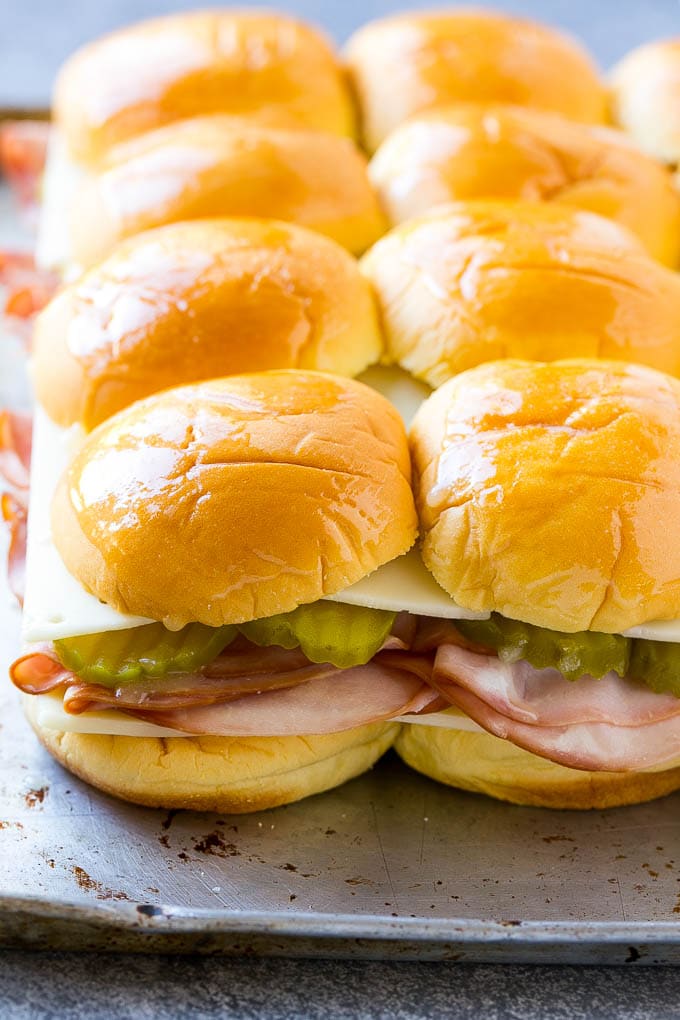 Cuban Sliders Recipe | Cuban Sandwich Recipe | Slider Sandwiches | Ham and Cheese Sliders #sliders #sandwiches #ham #cheese #appetizer #edsug Assembled slider sandwiches ready to go into the oven.