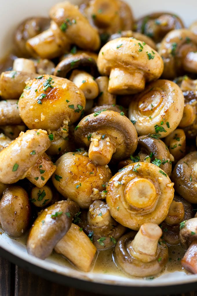 Garlic Mushrooms Recipe | Steakhouse Mushrooms | Sauteed Mushrooms | Garlic Butter Mushrooms | Mushroom Side Dish #mushrooms #butter #keto #lowcarb #dinner #sidedish #edsug Garlic mushrooms in an herb and butter sauce in a frying pan.