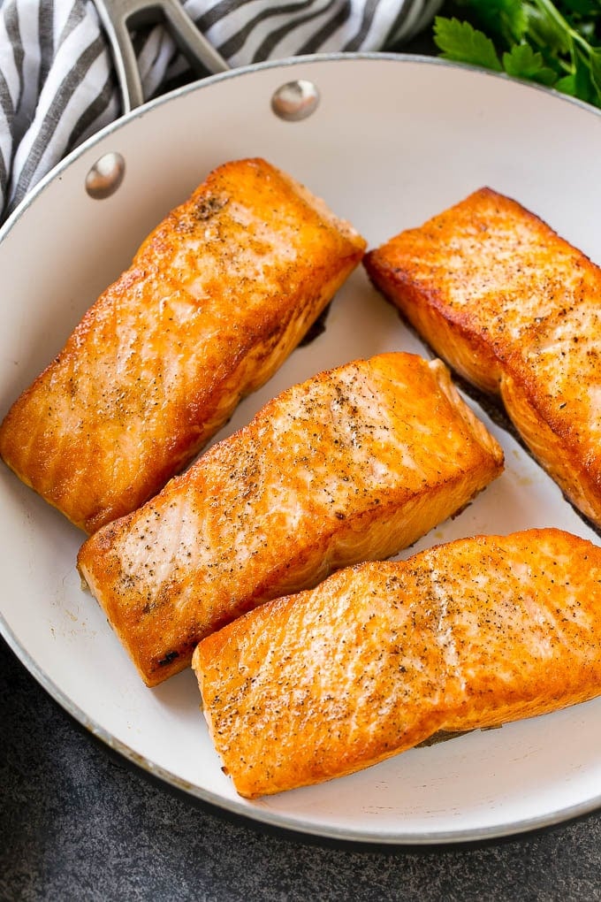Honey Garlic Salmon Recipe | Asian Salmon Recipe | Healthy Salmon Recipe #salmon #fish #seafood #healthy #dinner #edsug Seared salmon fillets in a frying pan.