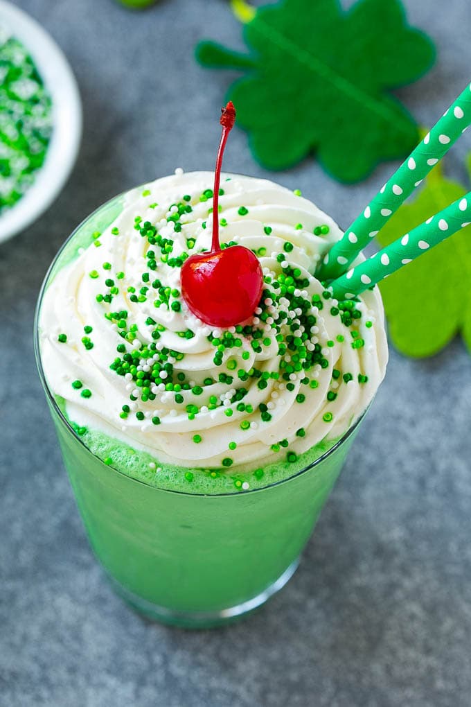 Shamrock Shake Recipe | McDonald's Shamrock Shake | Saint Patrick's Day Drink | Mint Milkshake #milkshake #stpatricksday #saintpatricksday #mint #edsug A mint Shamrock shake finished off with a swirl of whipped cream sprinkles and a cherry.