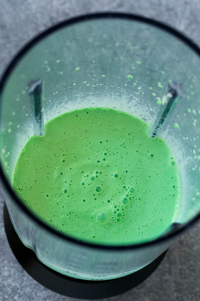 Shamrock Shake Recipe | McDonald's Shamrock Shake | Saint Patrick's Day Drink | Mint Milkshake #milkshake #stpatricksday #saintpatricksday #mint #edsug Green milkshake in a blender.