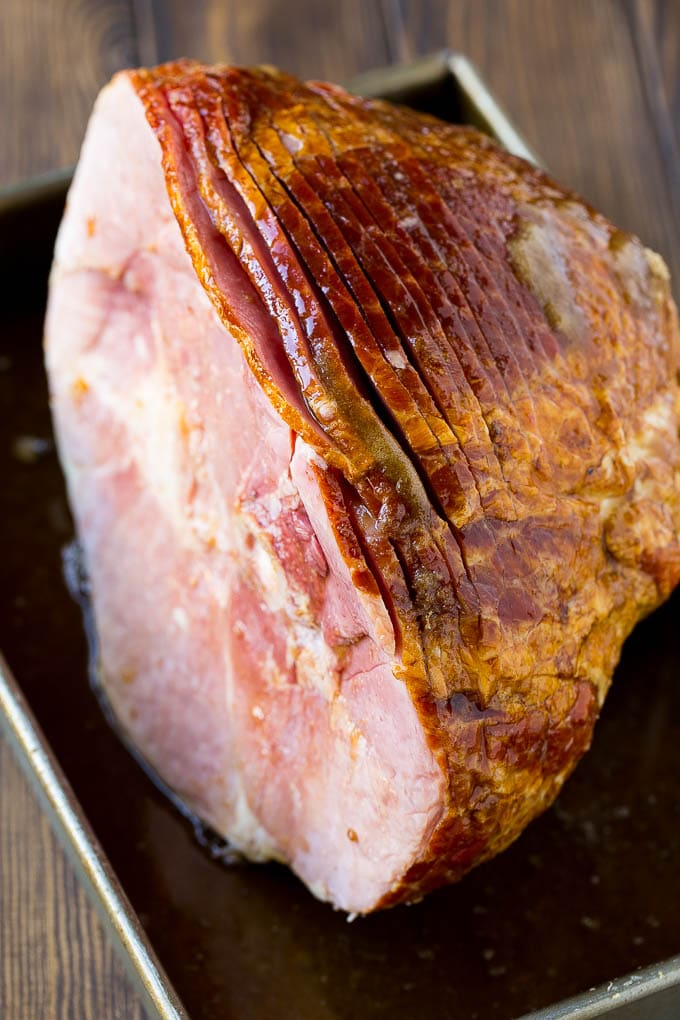 Coca Cola Ham | Coke Glazed Ham | Easter Ham | Christmas Ham | Holiday Ham Recipe #ham #easter #christmas #dinner #edsug An uncooked spiral ham topped with coke and brown sugar.