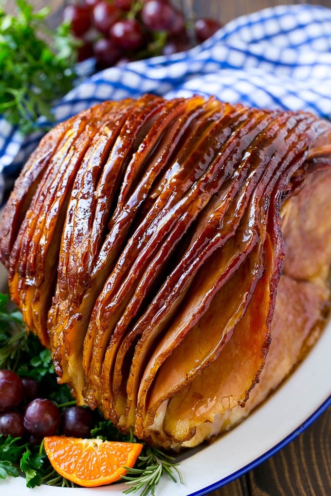 Coca Cola Ham | Coke Glazed Ham | Easter Ham | Christmas Ham | Holiday Ham Recipe #ham #easter #christmas #dinner #edsug A whole spiral cut coca cola ham on a platter.