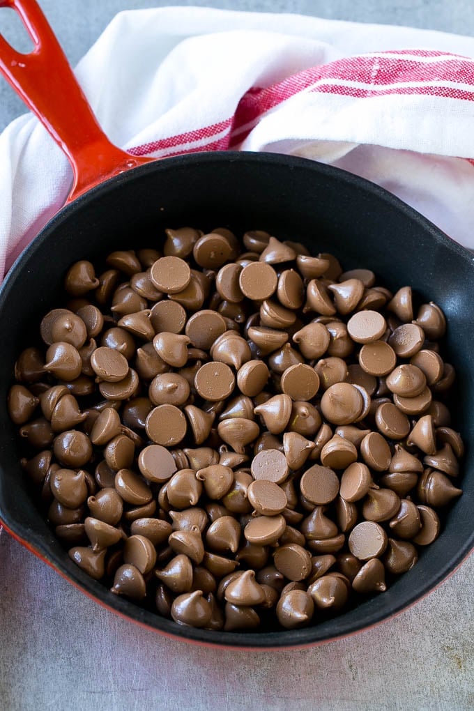 S'mores Dip Recipe | S'mores Skillet | Baked S'mores #smores #dip #chocolate #marshmallow #dessert #edsug A skillet of milk chocolate chips.