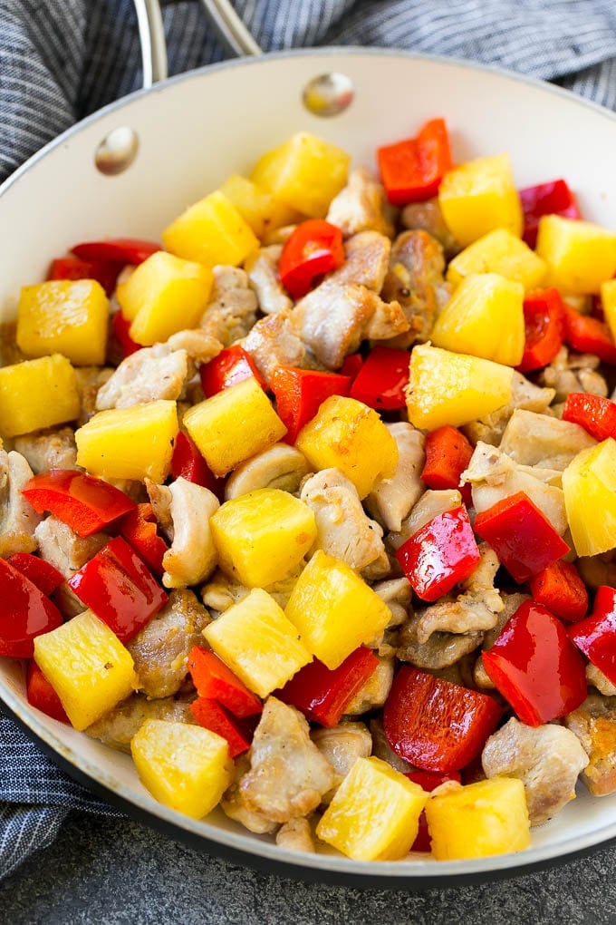 Pineapple Chicken | Hawaiian Chicken | Chicken Stir Fry #pineapple #chicken #dinner #stirfry #edsug A skillet of cooked chicken, pineapple and red bell peppers.