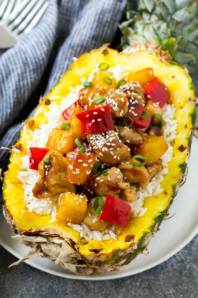 Pineapple Chicken | Hawaiian Chicken | Chicken Stir Fry #pineapple #chicken #dinner #stirfry #edsug Pineapple chicken stir fry over rice served inside half a pineapple.