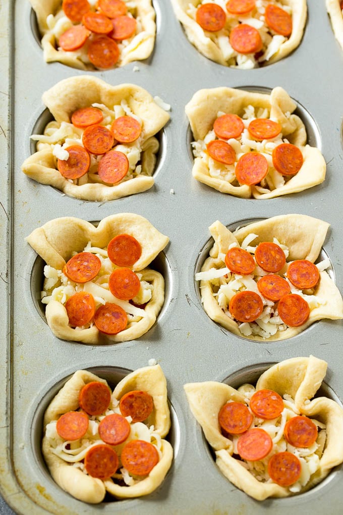 Pizza Muffins Recipe | Pizza Bites | Pizza Cups | Pizza Appetizer #pizza #appetizer #edsug Unbaked dough cups filled with cheese, sauce and pepperoni.