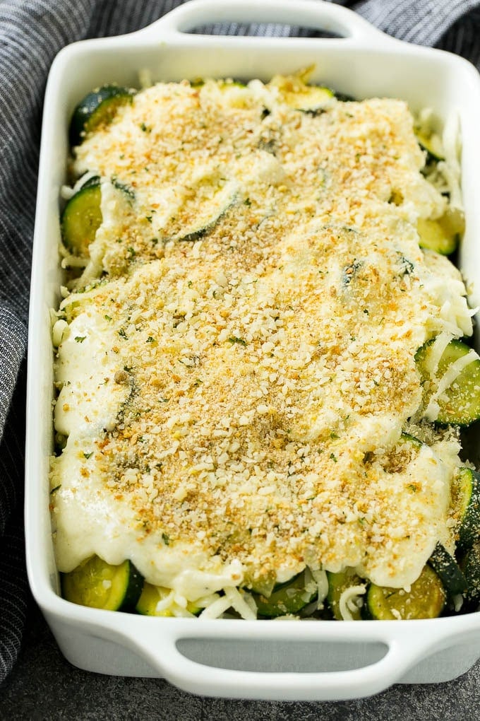 Zucchini Gratin Recipe | Cheesy Zucchini | Baked Zucchini | Easy Zucchini Recipe #zucchini #casserole #cheese #dinner #sidedish #edsug Zucchini gratin with layers of cheese, sauce and breadcrumbs, ready to go into the oven.