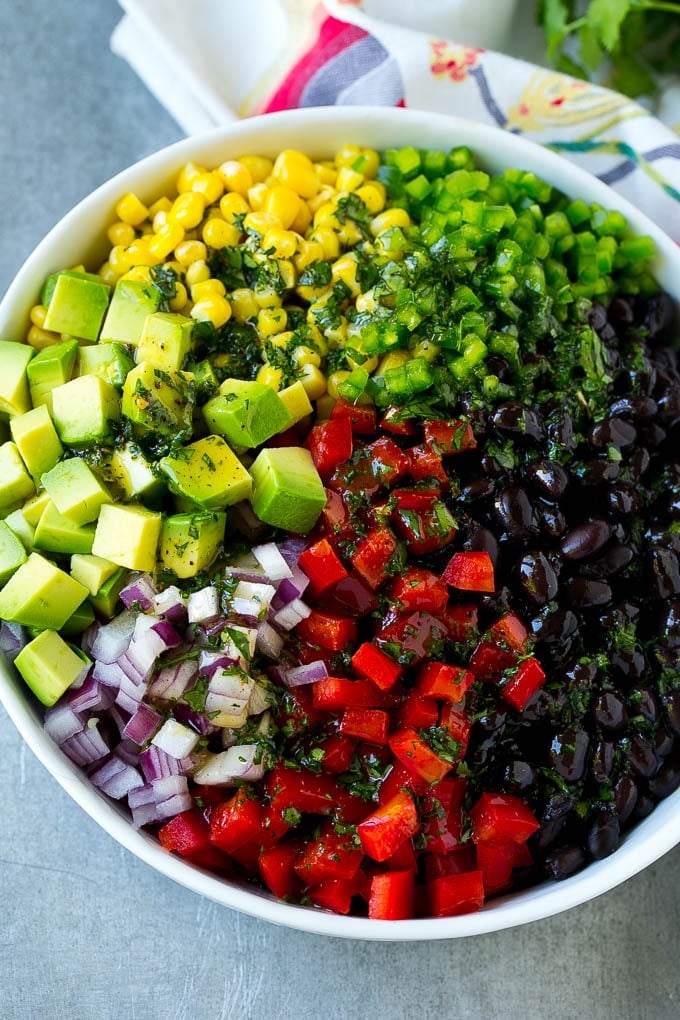 Black Bean and Corn Salad Recipe | Mexican Salad | Black Bean Salad | Bean Salad #salad #beans #corn #mexicanfood #edsug Black beans, corn and assorted vegetables topped with cilantro lime dressing.