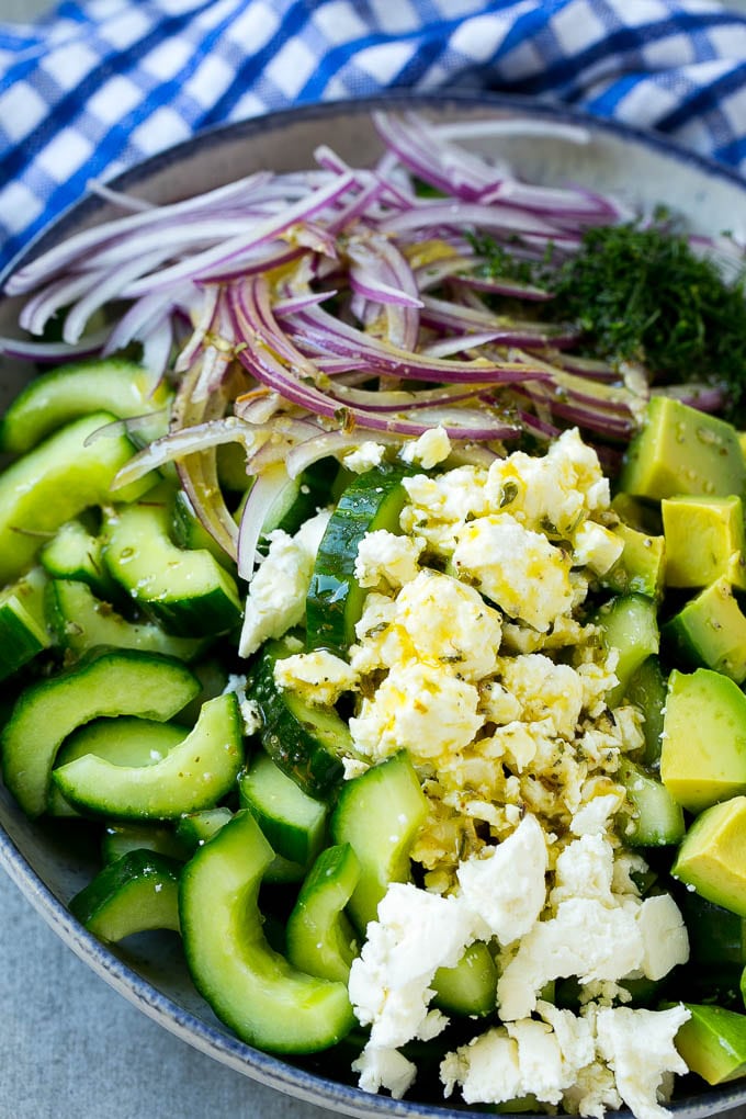Cucumber Feta Salad Recipe | Cucumber Salad | Feta Cheese Salad | Summer Salad #salad #cucumber #edsug Veggies and cheese topped with Greek dressing.