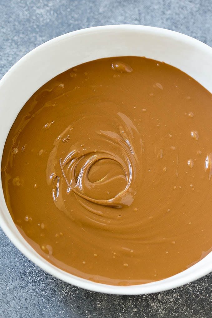 Haystack Cookies Recipe | No Bake Cookies | Chow Mein Noodle Cookies #nobakecookies #cookies #recipe #chocolate #edsug A bowl of melted milk chocolate chips and butterscotch chips.