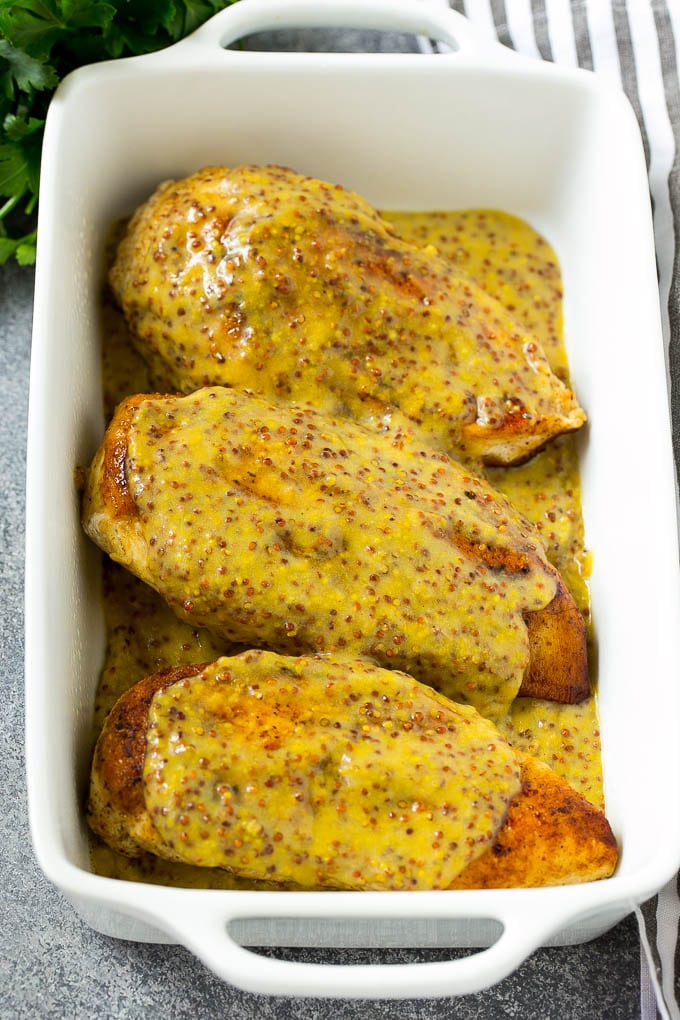 Honey Mustard Chicken Recipe | Baked Chicken Recipe | Easy Chicken Recipe #chicken #dinner #edsug Chicken breasts in a baking dish topped with sauce.