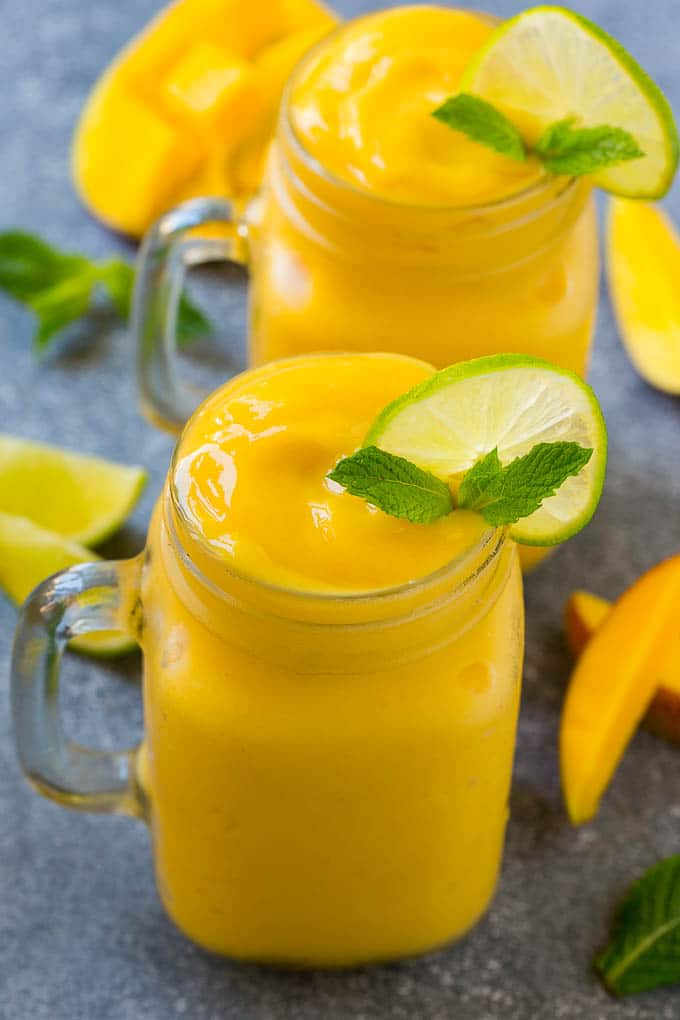 Mango Smoothie Recipe | Mango Recipe | Healthy Smoothie #mango #smoothie #drink #edsug Mango smoothie in a mason jar mug.