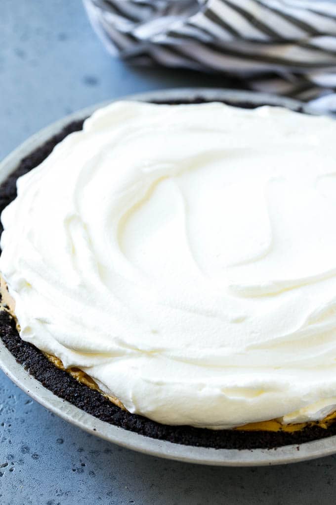 Chocolate Peanut Butter Pie Recipe | Peanut Butter Cup Pie | Peanut Butter Pie | No Bake Pie #chocolate #peanutbutter #pie #nobake #dessert #edsug Whipped cream topping on top of a nut butter tart.