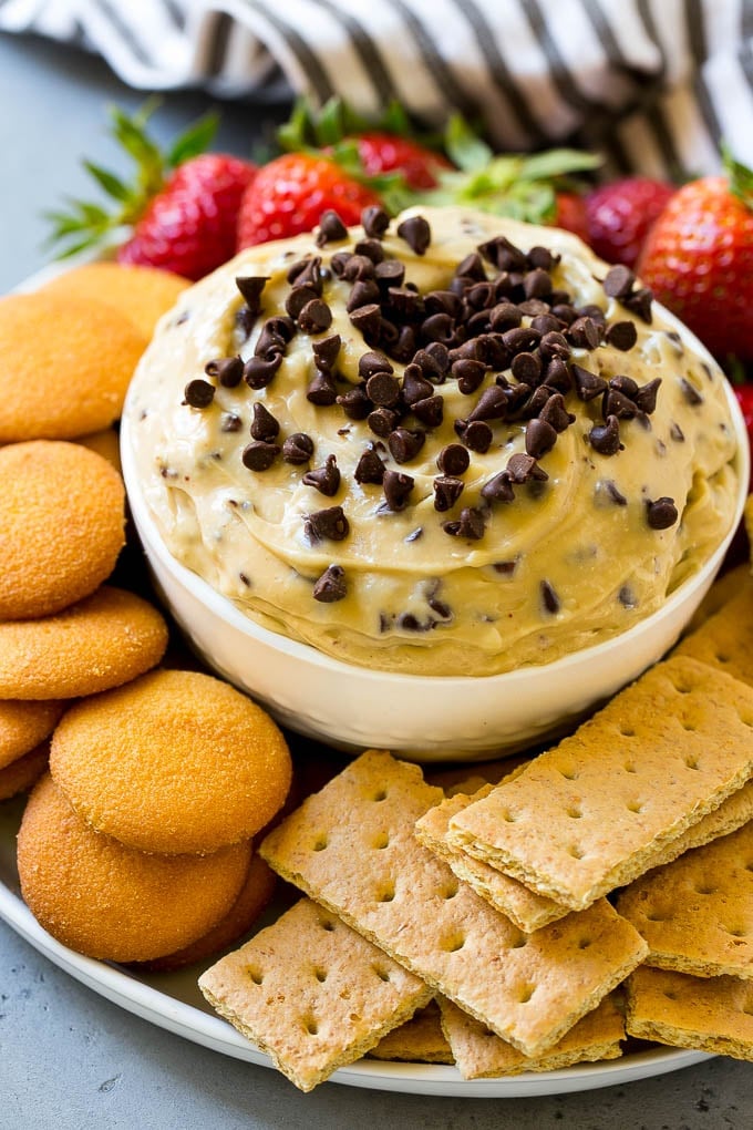 Cookie Dough Dip Recipe | Edible Cookie Dough | Chocolate Chip Cookie Dip #cookies #dip #cookiedough #dessert #snack #edsug Chocolate chip cookie dough dip, topped with mini chocolate chips and served with graham crackers and vanilla wafers.