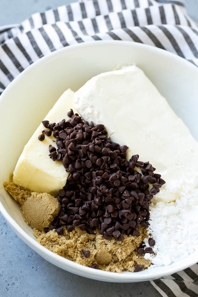 Cookie Dough Dip Recipe | Edible Cookie Dough | Chocolate Chip Cookie Dip #cookies #dip #cookiedough #dessert #snack #edsug Ingredients including butter, cream cheese, chocolate chips and brown sugar.