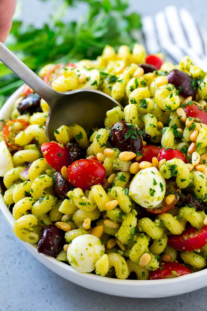 Pesto Pasta Salad | Italian Pasta Salad | Easy Pasta Salad #pasta #salad #pesto #olives #tomatoes #edsug Pesto pasta salad with cherry tomatoes, olives, mozzarella balls, pine nuts and red onion.