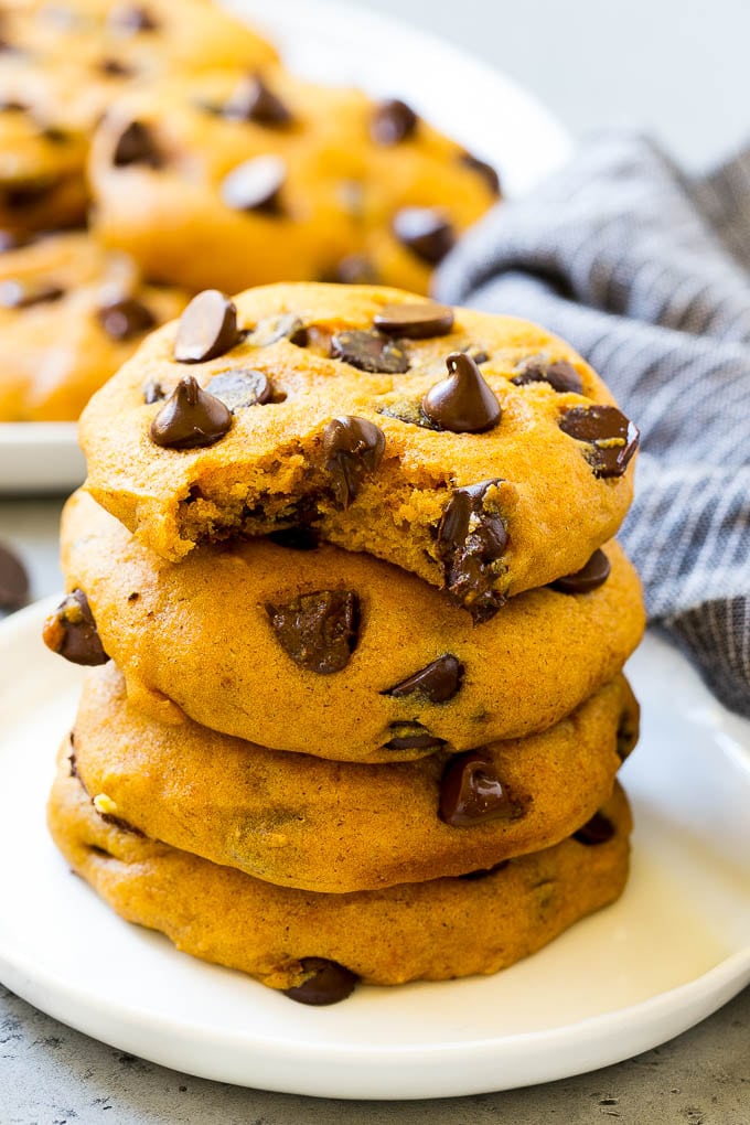 Pumpkin Chocolate Chip Cookies Recipe | Pumpkin Cookies | Pumpkin Chocolate Cookies #pumpkin #cookies #chocolate #baking #fall #edsug #dessert A stack of pumpkin chocolate chip cookies.