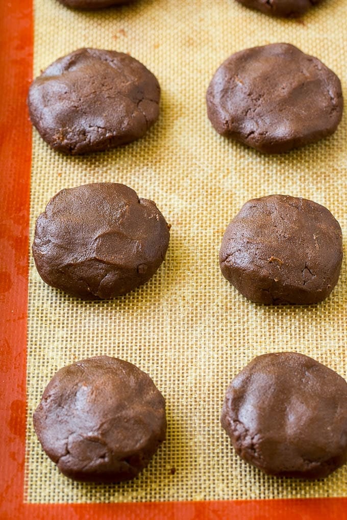 Nutella Cookies Recipe | Nutella Stuffed Cookies | Chocolate Cookies #nutella #chocolate #cookies #baking #dessert #edsug Nutella cookie dough on a baking sheet.