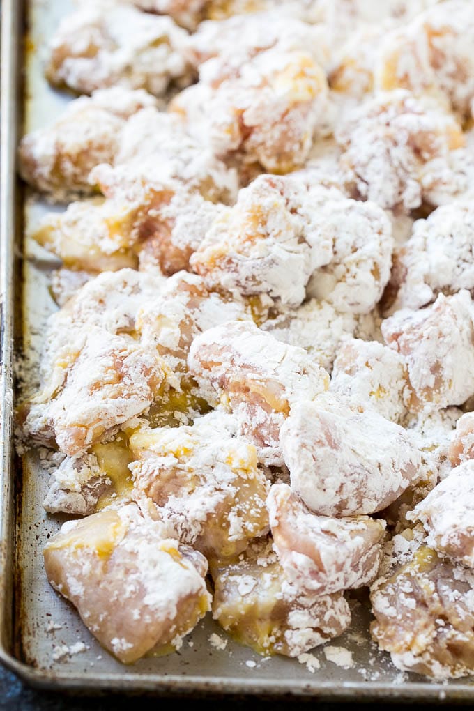 Orange Chicken Recipe | Chinese Orange Chicken | Panda Express Orange Chicken #orange #chicken #takeout #chinesefood #dinner #edsug Chicken pieces coated in egg and flour.