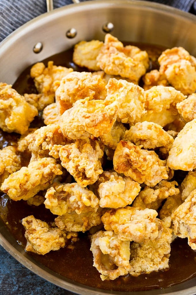 Orange Chicken Recipe | Chinese Orange Chicken | Panda Express Orange Chicken #orange #chicken #takeout #chinesefood #dinner #edsug Crispy chicken pieces in a pan of orange sauce.
