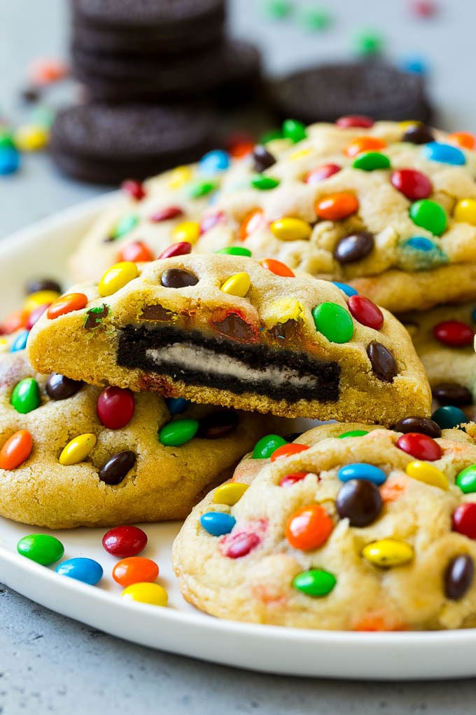 Oreo Stuffed Cookies Recipe | M&M's cookies | Stuffed Cookies #cookies #chocolate #oreos #dessert #baking #edsug A plate of Oreo stuffed cookies topped with miniature M&M's.