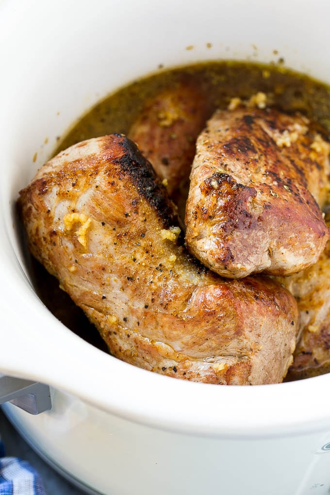 Slow Cooker Pork Tenderloin Recipe | Crock Pot Pork Tenderloin | Easy Pork Tenderloin #slowcooker #crockpot #pork #dinner #edsug Seared pork tenderloin in a slow cooker with seasonings.