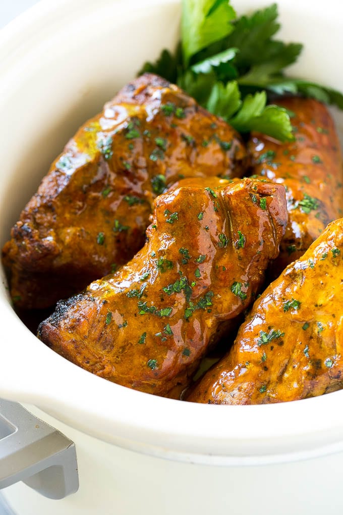 Slow Cooker Pork Tenderloin Recipe | Crock Pot Pork Tenderloin | Easy Pork Tenderloin #slowcooker #crockpot #pork #dinner #edsug Slow cooker pork tenderloins coated with sauce, inside a crock pot.
