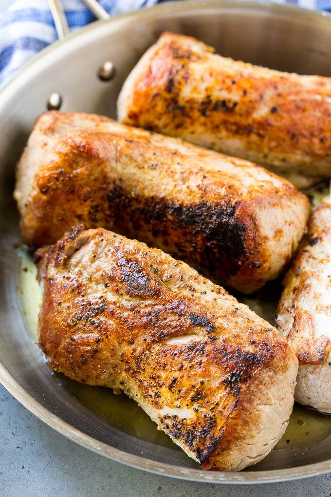 Slow Cooker Pork Tenderloin Recipe | Crock Pot Pork Tenderloin | Easy Pork Tenderloin #slowcooker #crockpot #pork #dinner #edsug Seared pork tenderloin in a skillet.