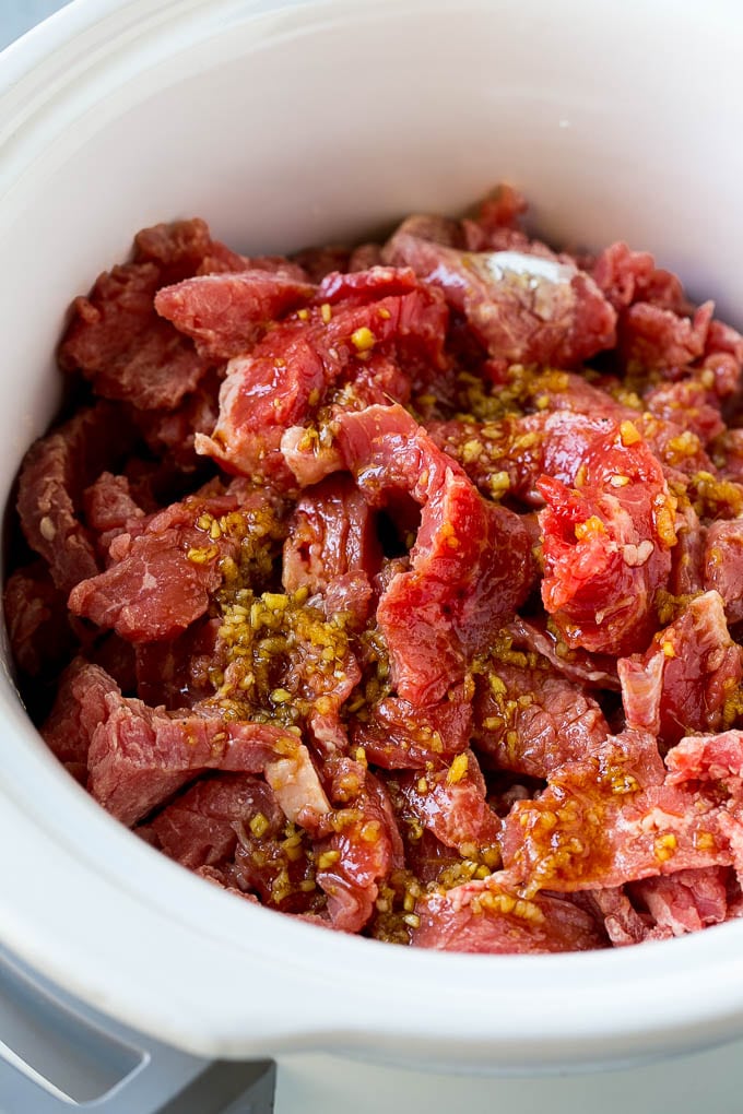 Slow Cooker Korean Beef Recipe | Korean Beef | Flank Steak Recipe #dinner #beef #slowcooker #crockpot #asian #edsug Flank steak strips in a soy, ginger and garlic sauce.