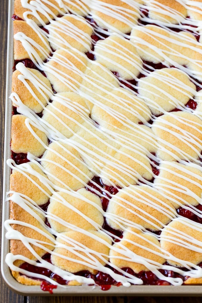 Cherry Bars Recipe | Cherry Pie Bars | Cherry Cookies | Bar Cookies #cookies #bars #cherry #baking #dessert #sweets #edsug Cherry bars topped with vanilla glaze.