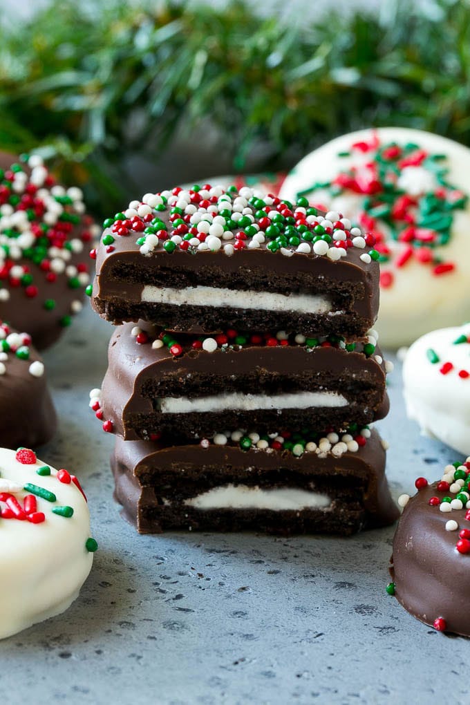 Chocolate Covered Oreos Recipe | Oreo Cookies | Chocolate Dipped Oreos #oreo #cookies #chocolate #sprinkles #dessert #edsug A stack of chocolate covered Oreos.