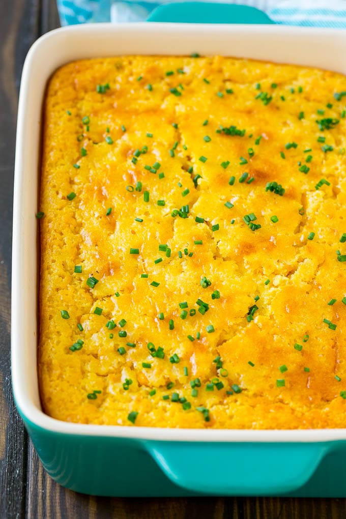 Corn Pudding Recipe | Corn Casserole | Corn Side Dish #corn #pudding #casserole #sidedish #thanksgiving #dinner #edsug A casserole dish of corn pudding topped with chives.