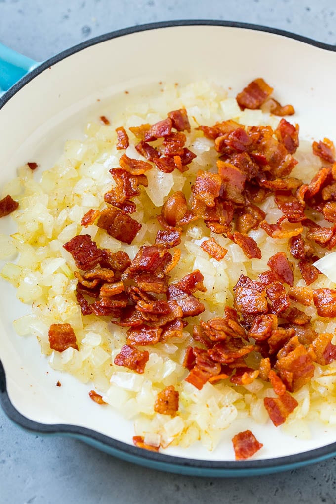 Fried Cabbage Recipe | Cabbage with Bacon | Cabbage Side Dish #cabbage #bacon #sidedish #lowcarb #keto #edsug Sauteed bacon and onions in a skillet.