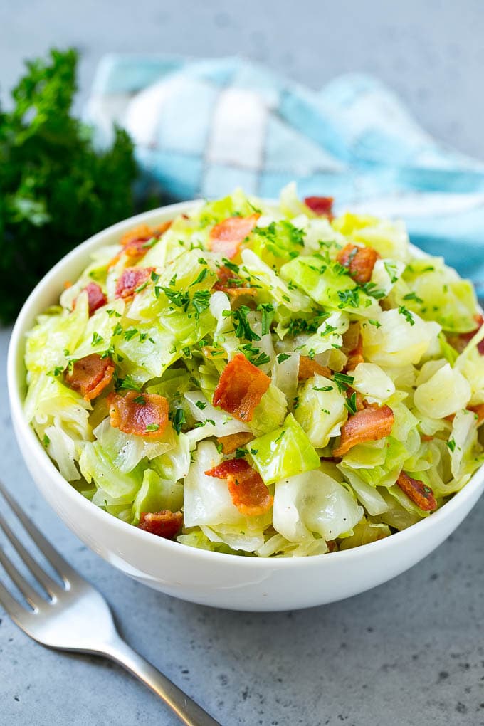Fried Cabbage Recipe | Cabbage with Bacon | Cabbage Side Dish #cabbage #bacon #sidedish #lowcarb #keto #edsug A bowl of fried cabbage topped with bacon and parsley.