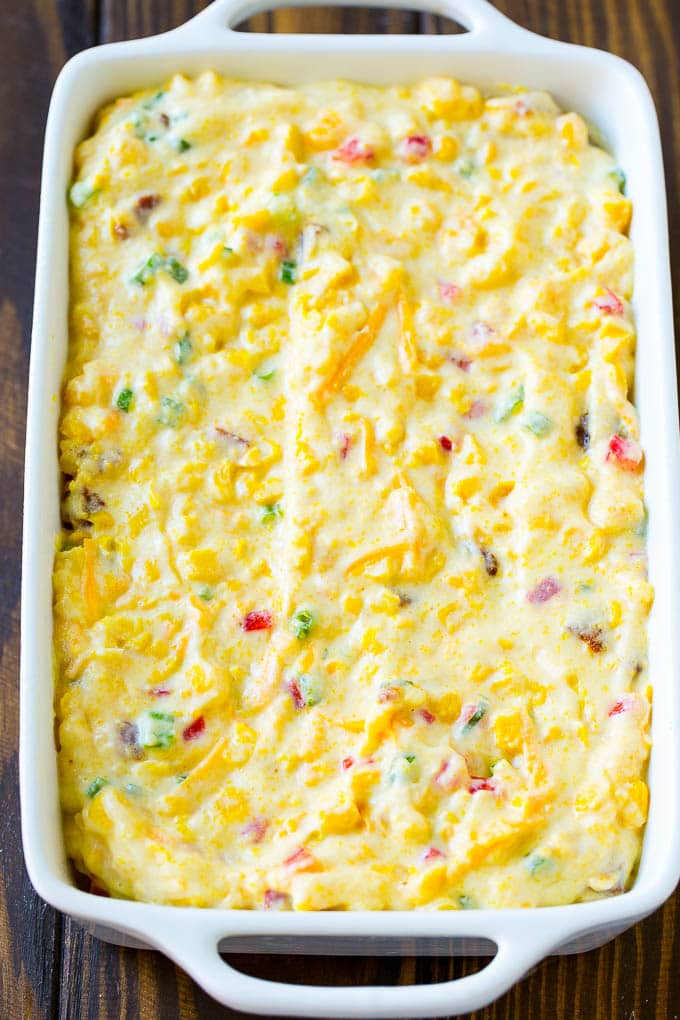 Loaded Corn Casserole Recipe | Easy Corn Casserole | Bacon Corn Casserole | Corn Pudding #corn #casserole #bacon #cheese #sidedish #thanksgiving #dinner #edsug Uncooked batter in a baking dish.