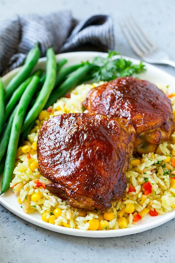 Smoked Chicken Thighs Recipe | Barbecue Chicken Thighs | Easy Chicken Thighs #chicken #barbecue #smoker #dinner #edsug A serving of smoked chicken thighs served with rice and green beans.