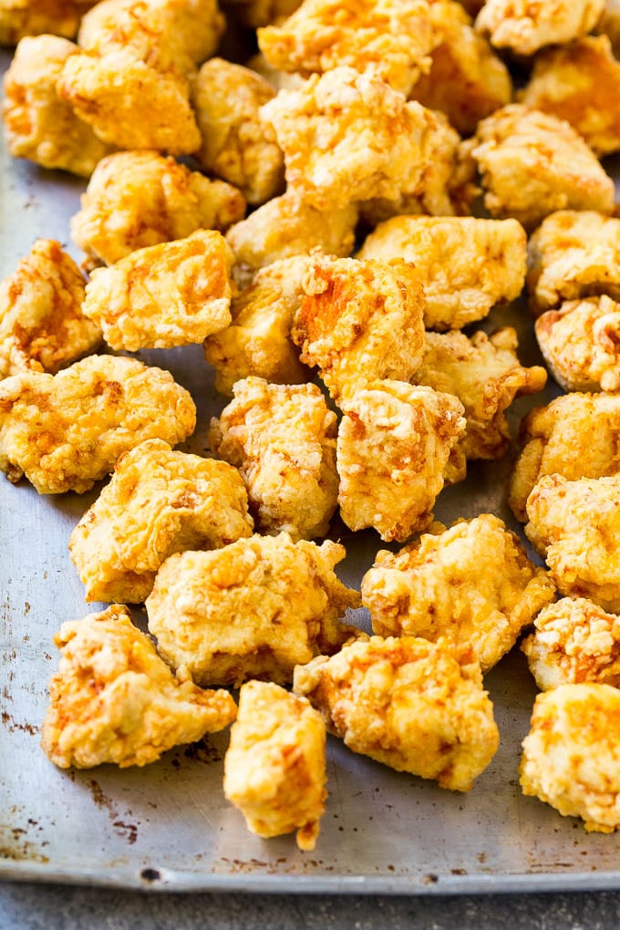 Sweet Chili Chicken Recipe | Thai Chicken | Asian Chicken #chicken #thaifood #chili #dinner #edsug Fried chicken breast pieces on a sheet pan.